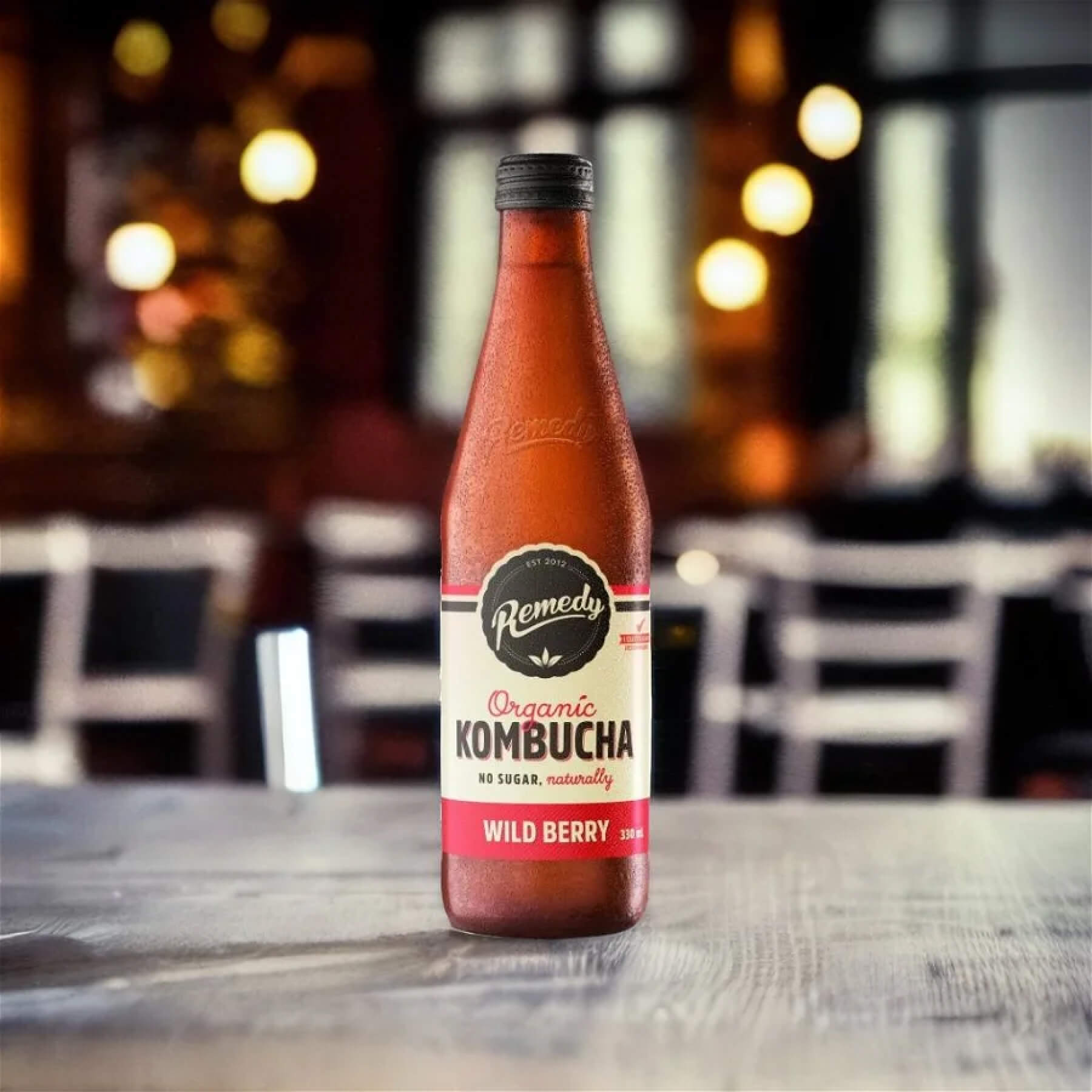 A product On a wooden table in a restaurant with diners in the background